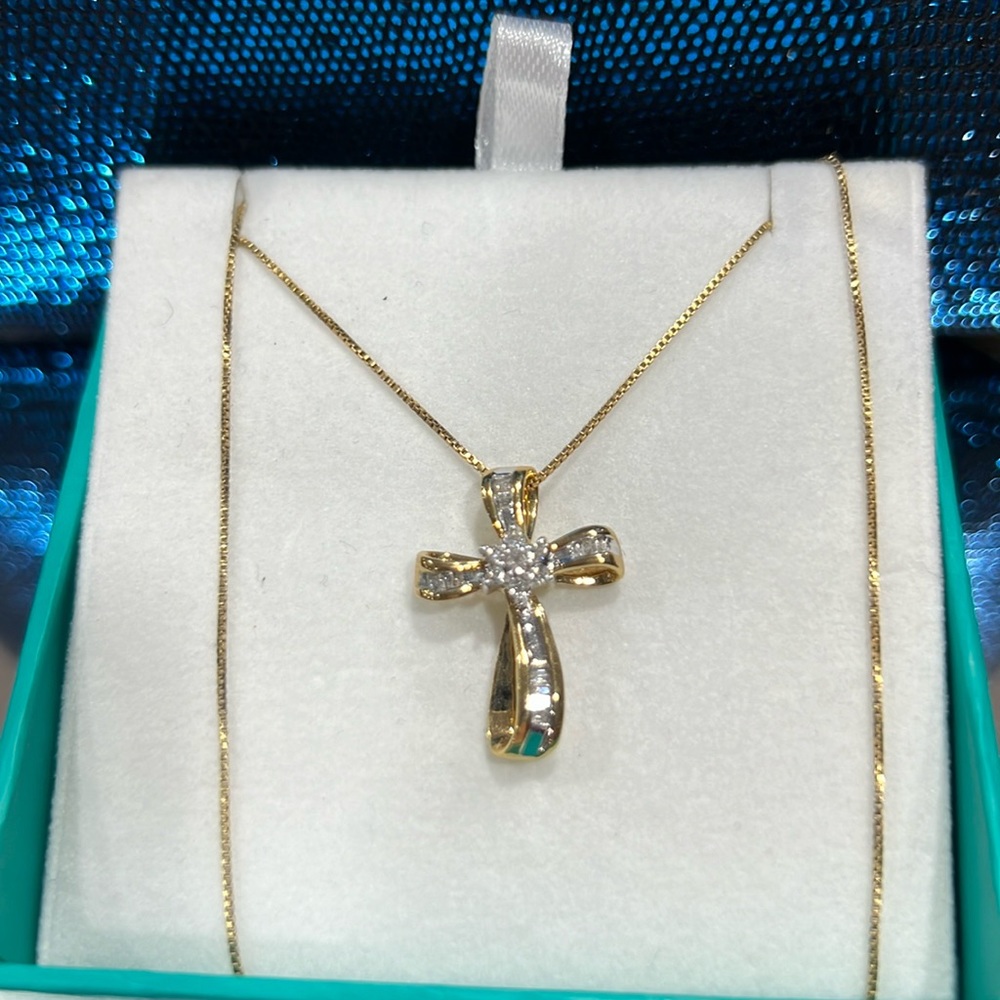 Diamond cross with 1/4 carat genuine diamonds. From Kay Jewelers.